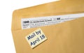 Tax Day reminder for April 18 on envelope for filing returns for 2022