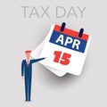 Tax Day Reminder Concept Design - Attention, Businessman Pointing to a Paper Calendar Page - USA Tax Payment Deadline, Due Date Royalty Free Stock Photo