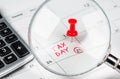 Tax day written on a calendar with a red pushpin. Royalty Free Stock Photo