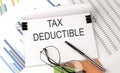 TAX DEDUCTIBLE text on the chart , office supplies, business concept