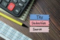 Tax Deduction Source write on sticky notes isolated on office desk Royalty Free Stock Photo