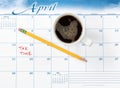 Tax due date marked in red on calendar with coffee drink Royalty Free Stock Photo