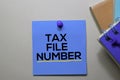 Tax File Number text on sticky notes isolated on office desk