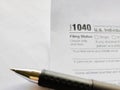 Tax-filling concept - image of 1040 tax form background. Stock photo.