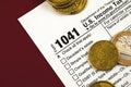 Tax form 1041, US Income tax return for estates and trusts, close up with coins Royalty Free Stock Photo