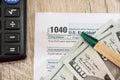 Tax forms 1040, calculator, dollars and pen on the table Royalty Free Stock Photo