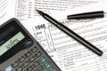 Tax forms, calculator and pen Royalty Free Stock Photo