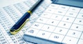 Tax forms, spread sheet with pen and calculator Royalty Free Stock Photo