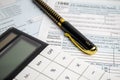 Tax forms, spread sheet with pen and calculator Royalty Free Stock Photo