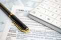 Tax forms, spread sheet with pen and calculator Royalty Free Stock Photo