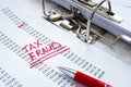 Tax fraud mark on audit results in the folder. Royalty Free Stock Photo