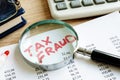 Tax fraud written on the audit report. Royalty Free Stock Photo