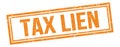 TAX LIEN text on orange grungy vintage stamp