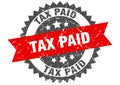 tax paid round grunge stamp. tax paid Royalty Free Stock Photo