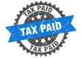 tax paid round grunge stamp. tax paid Royalty Free Stock Photo