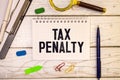 TAX PENALTY text on a sticky on chart Royalty Free Stock Photo