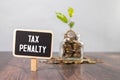 TAX PENALTY written on sticky on notebooks Royalty Free Stock Photo