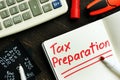 Tax preparation memo on the page of notepad. Royalty Free Stock Photo