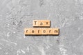 Tax reform word written on wood block. tax reform text on cement table for your desing, concept Royalty Free Stock Photo