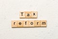 tax reform word written on wood block. tax reform text on cement table for your desing, concept Royalty Free Stock Photo