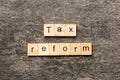 tax reform word written on wood block. tax reform text on cement table for your desing, concept Royalty Free Stock Photo