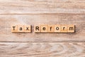 Tax reform word written on wood block. tax reform text on wooden table for your desing, concept Royalty Free Stock Photo