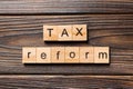 Tax reform word written on wood block. tax reform text on wooden table for your desing, concept Royalty Free Stock Photo