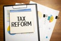 TAX REFORM is written on a notepad on an office desk Royalty Free Stock Photo
