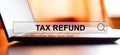 TAX REFUND - searching the Internet against the background of a laptop
