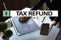 Tax refund text on virtual screen. Business and Finance concept.