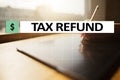 Tax refund text on virtual screen. Business and Finance concept. Royalty Free Stock Photo