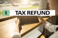 Tax refund text on virtual screen. Business and Finance concept.