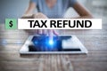 Tax refund text on virtual screen. Business and Finance concept.