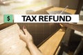 Tax refund text on virtual screen. Business and Finance concept. Royalty Free Stock Photo