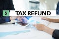 Tax refund text on virtual screen. Business and Finance concept. Royalty Free Stock Photo