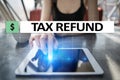 Tax refund text on virtual screen. Business and Finance concept. Royalty Free Stock Photo