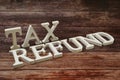 Tax Refund Word alphabet letters on wooden background