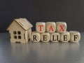 Tax relief symbol. Concept words \'tax relief\' on wooden blocks