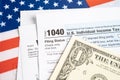 Tax Return form 1040 with USA America flag and dollar banknote, U.S. Individual Income Royalty Free Stock Photo