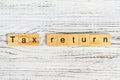 tax return word made with wooden blocks concept Royalty Free Stock Photo