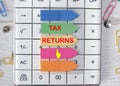 Tax returns text is written on the stickers that are on the calculator