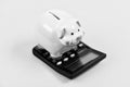 Tax savings. Piggy bank money savings. Investing gain profit. Calculate taxes. Piggy bank pig and calculator. Taxes and Royalty Free Stock Photo