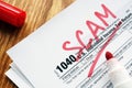 Tax scam. Form with sign on a desk Royalty Free Stock Photo