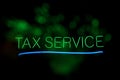 Tax ServiceVintage Tax Service Neon Sign With Green Bokeh