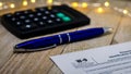 Tax still life business finance concept, form W9, with calculator, pen shallow DOF Royalty Free Stock Photo