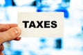 Tax text on blue blurred desktop monitor background Royalty Free Stock Photo