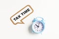 Tax time message note on white board with red retro clock Royalty Free Stock Photo