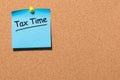 Tax time - Notification of the need to file tax returns pinned at cork board, tax form at accauntant workplace. With