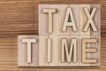 Tax time - text in vintage letters on wooden blocks Royalty Free Stock Photo