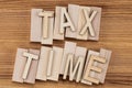 Tax time - text in vintage letters on wooden blocks Royalty Free Stock Photo